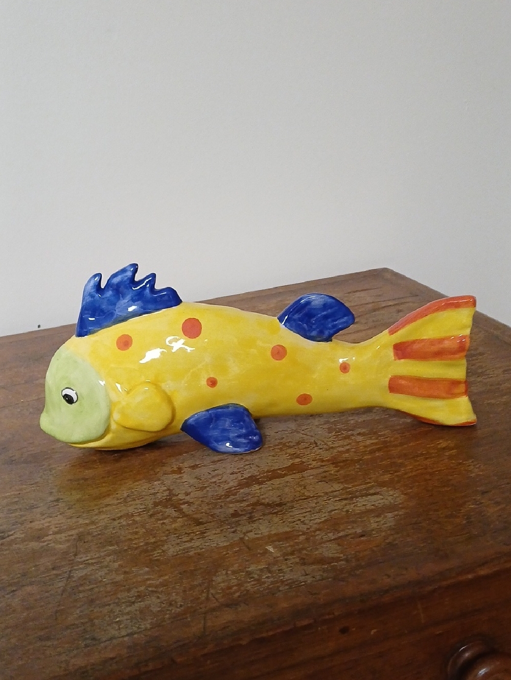 Decorative Yellow Ceramic Fish Figurine with Blue Fins